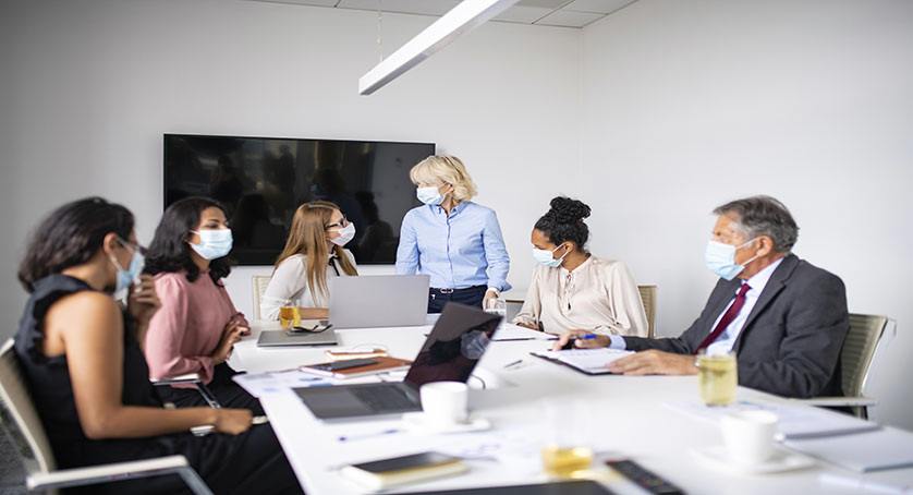 Business Colleagues Wearing Protective Masks During Meeting