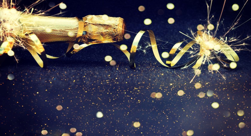 Champagne bottle and gold streamers