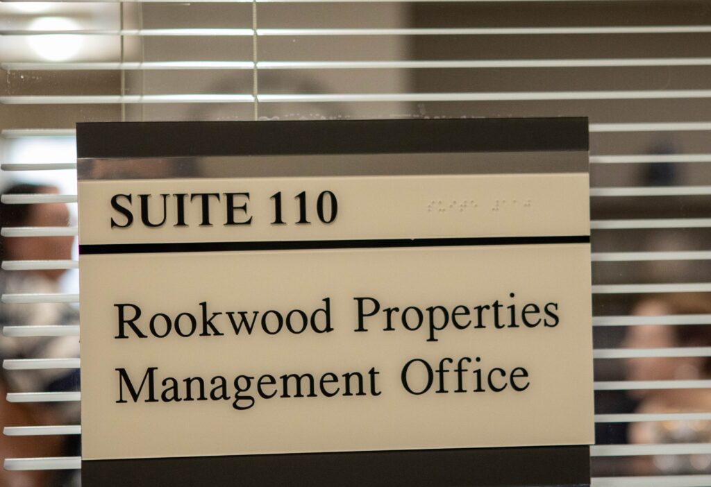 plaque at the front of office reading Rookwood Properties management office