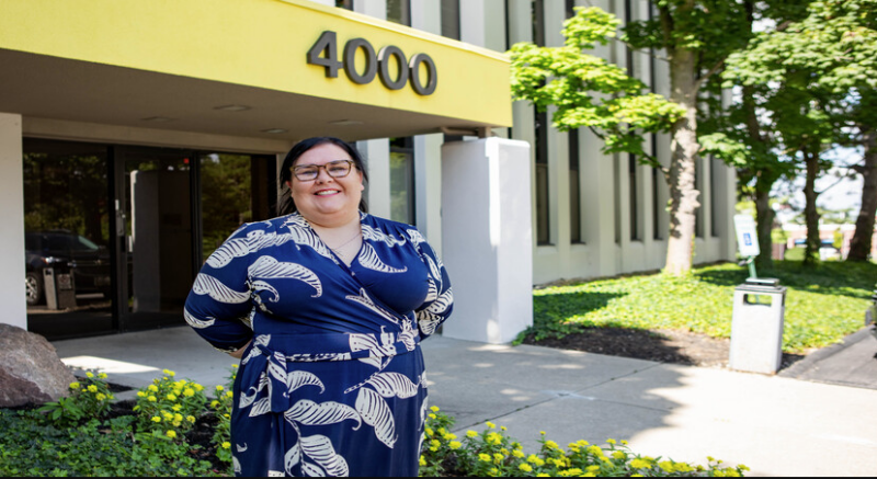 Chrissie Valdini of Rookwood Properties standing in front of their office building