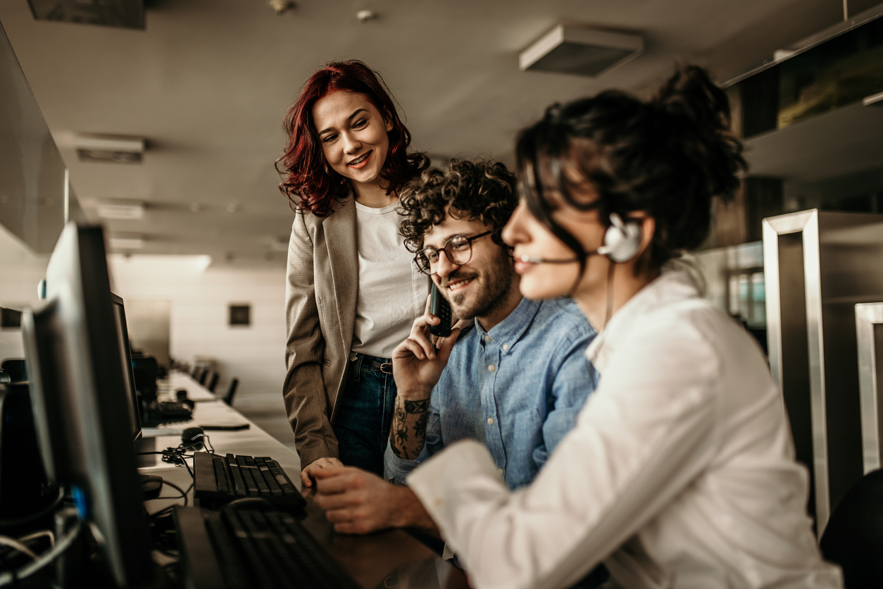 customer success with premium support team working together on the phone with a customer